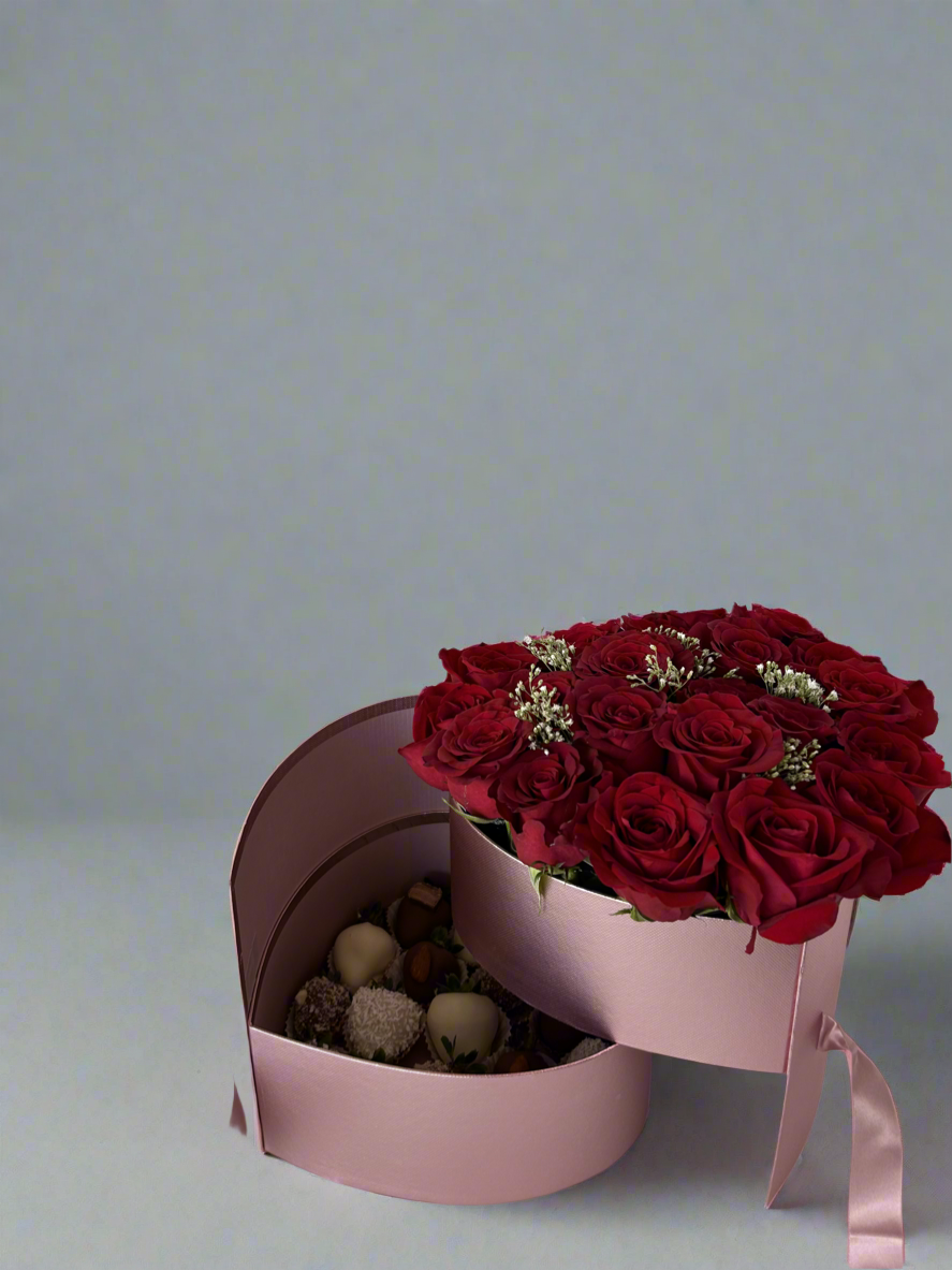 Pink two drawer heart shaped box with red roses and dipped strawberries