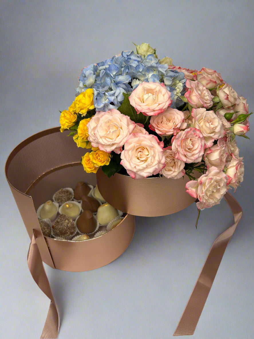 Pink box with flowers and chocolate dipped strawberries 
